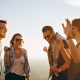 Adults with sunglasses laughing